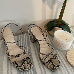 Snake print strappy block heel sandal.